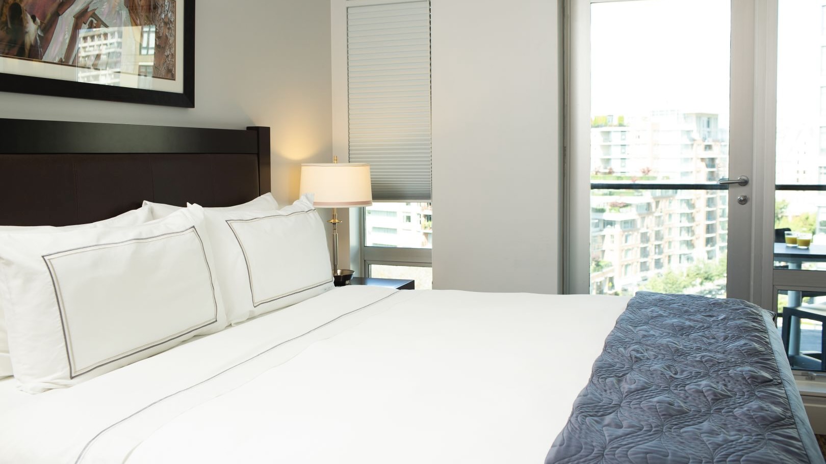The Parkside Hotel & Spa king bedroom at one of the best luxury hotels in Vancouver